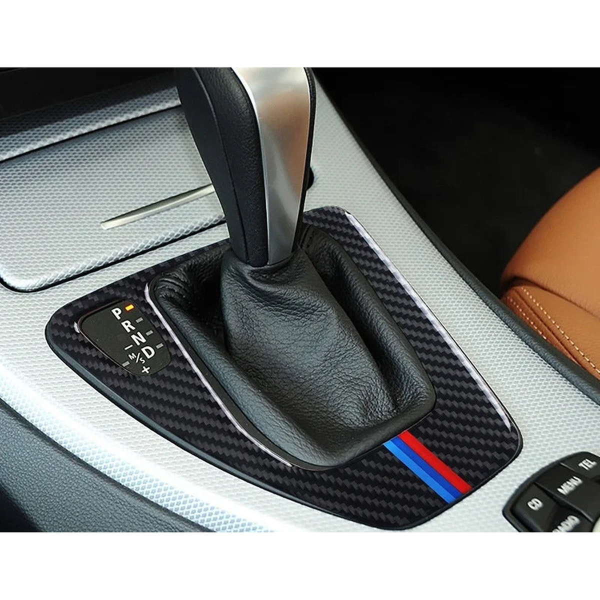 Carbon fiber gear shift panel frame installed in a BMW 3 Series E90, E92, E93 (2005-2012) center console