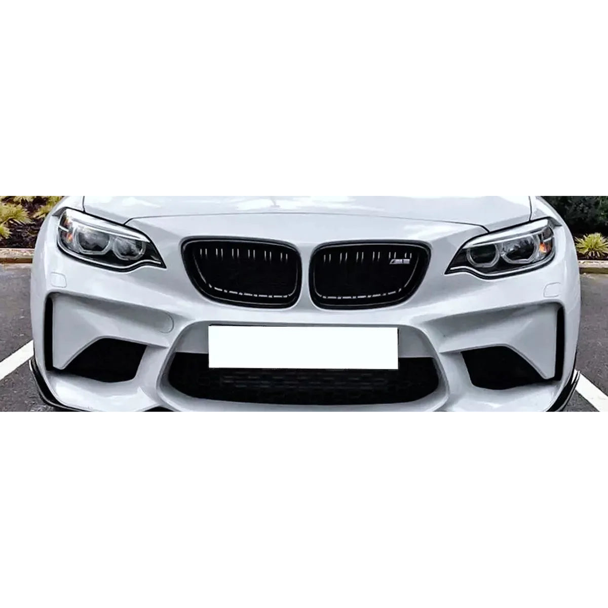 Gloss black double slat kidney grilles fitted on a BMW front bumper for BMW 2 Series F22 F23 F87 M2 (2014-2018)