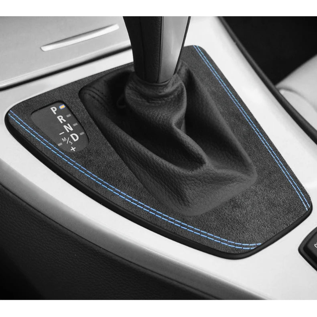 Blue stitched Alcantara gear selector panel trim fitted around the automatic shifter in a BMW E90 / E92 / E93