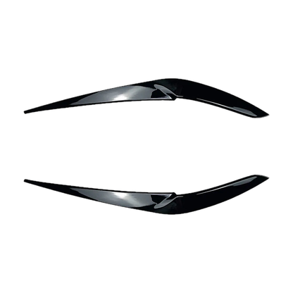 Gloss black finish headlight eyebrow trims, close angled view, for BMW X5 G05 / X6 G06 (2018-2022)