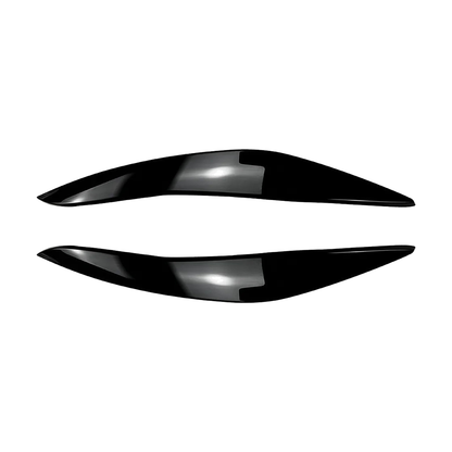 Gloss black headlight eyelid trim pair for BMW 5 Series F10 / F11, front view