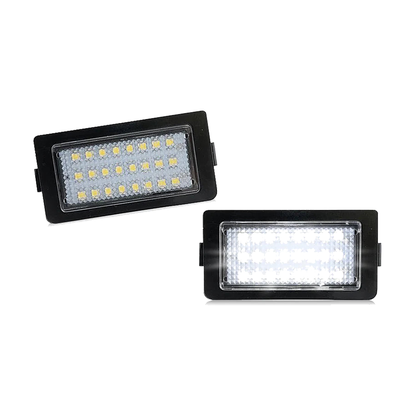 Black LED license plate lights for BMW E38, pair, front lens view