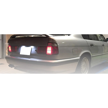 LED license plate light for BMW E38, installed on rear license plate