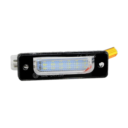 Black LED license plate light with connector, angled view, for BMW E34, E32 (1986-1996)