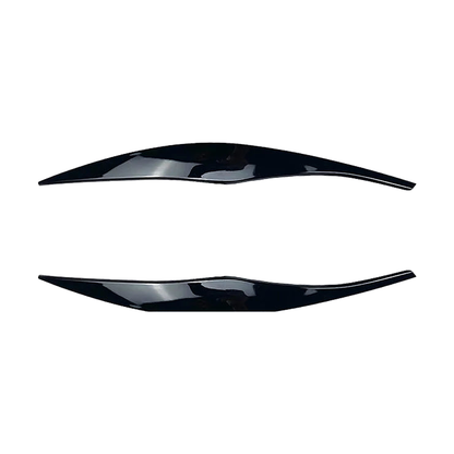 Gloss black headlight eyebrow trim pair for BMW E90 / E91, front view