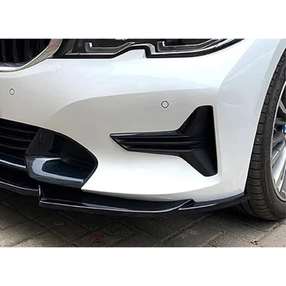 Gloss black front bumper lip fitted under the front bumper of a white BMW G20 / G21 non M Sport