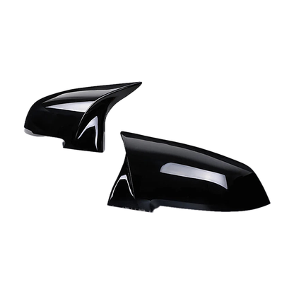 Gloss black mirror cap cover pair, angled view, for BMW F20 / F30 / F32 / X1 E84