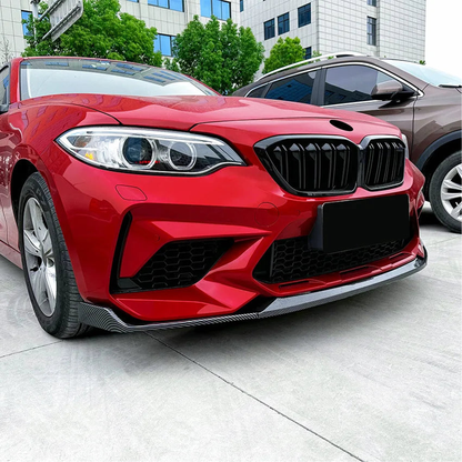 Front splitter lip fitted on a red BMW M2, close up, for BMW F87 M2 Competition, M2 CS (2018-2021)