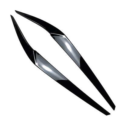Gloss black headlight eyebrow trims for BMW 5 Series G30 / G31 / G38 / F90 M5, angled view