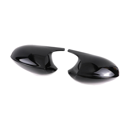 Gloss black mirror cap pair, angled view, for BMW E81 / E82 / E87 / E88 / E90 / E91 / E92 / E93