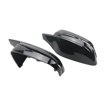 Gloss black mirror caps showing the inner mounting side and the outer shell, for BMW G20 / G22 / G30 / G11