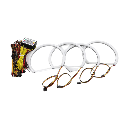 Four white RGBW LED halo rings in a row with controller and plug leads for BMW E46 / E39 / E38