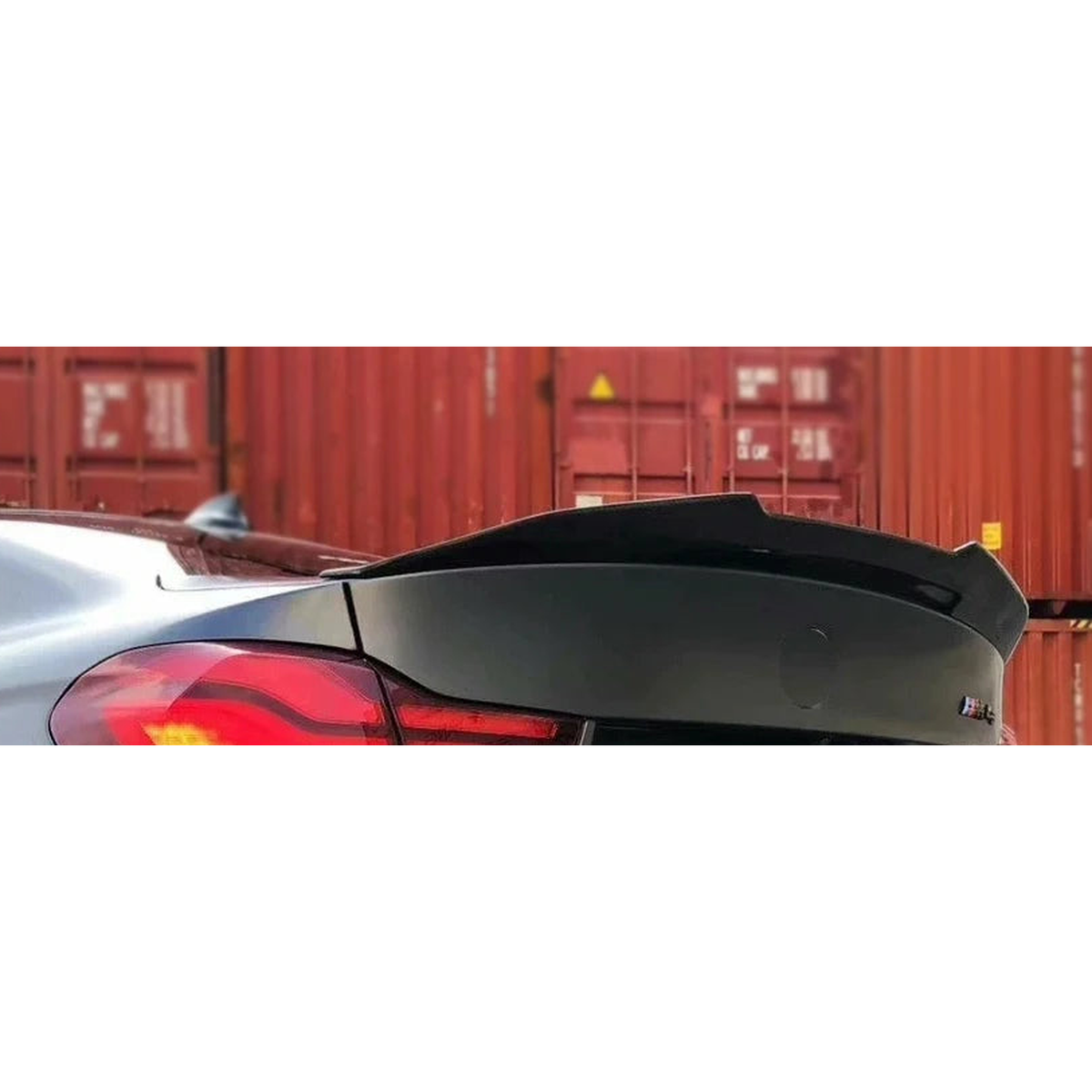 PSM style gloss black boot spoiler fitted on a grey BMW M4, for BMW F32 / F33 / F36 4 Series