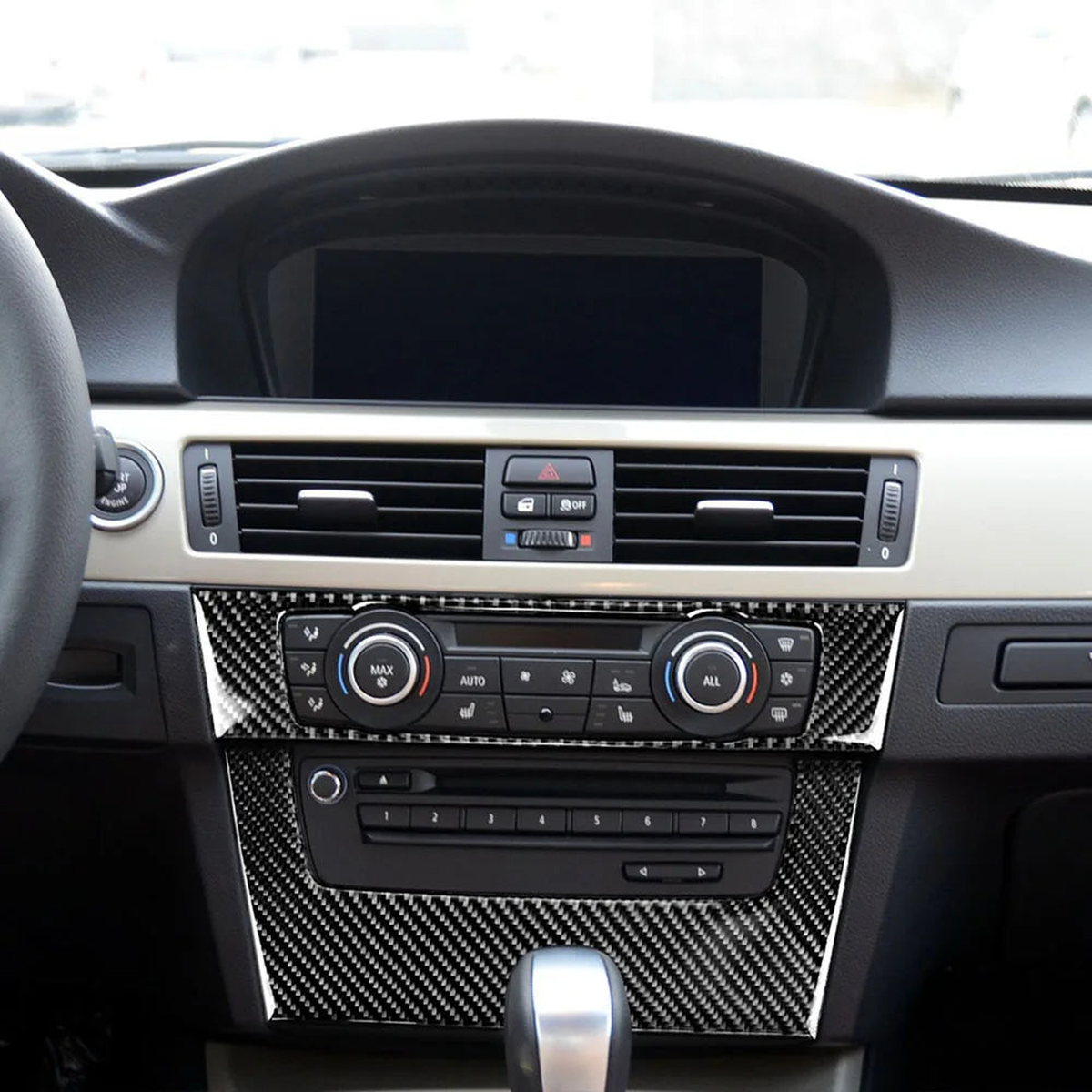 Carbon fibre climate and radio panel cover fitted in a BMW E90, E92, E93 (2005-2012) interior