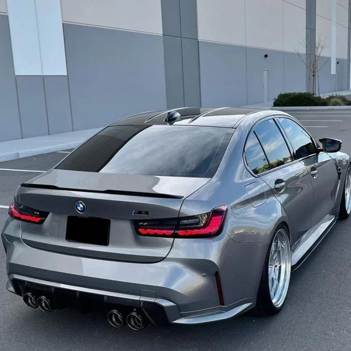 M3-style rear roof spoiler fitted on a BMW 3 Series G20 (2019-2023), rear three-quarter view