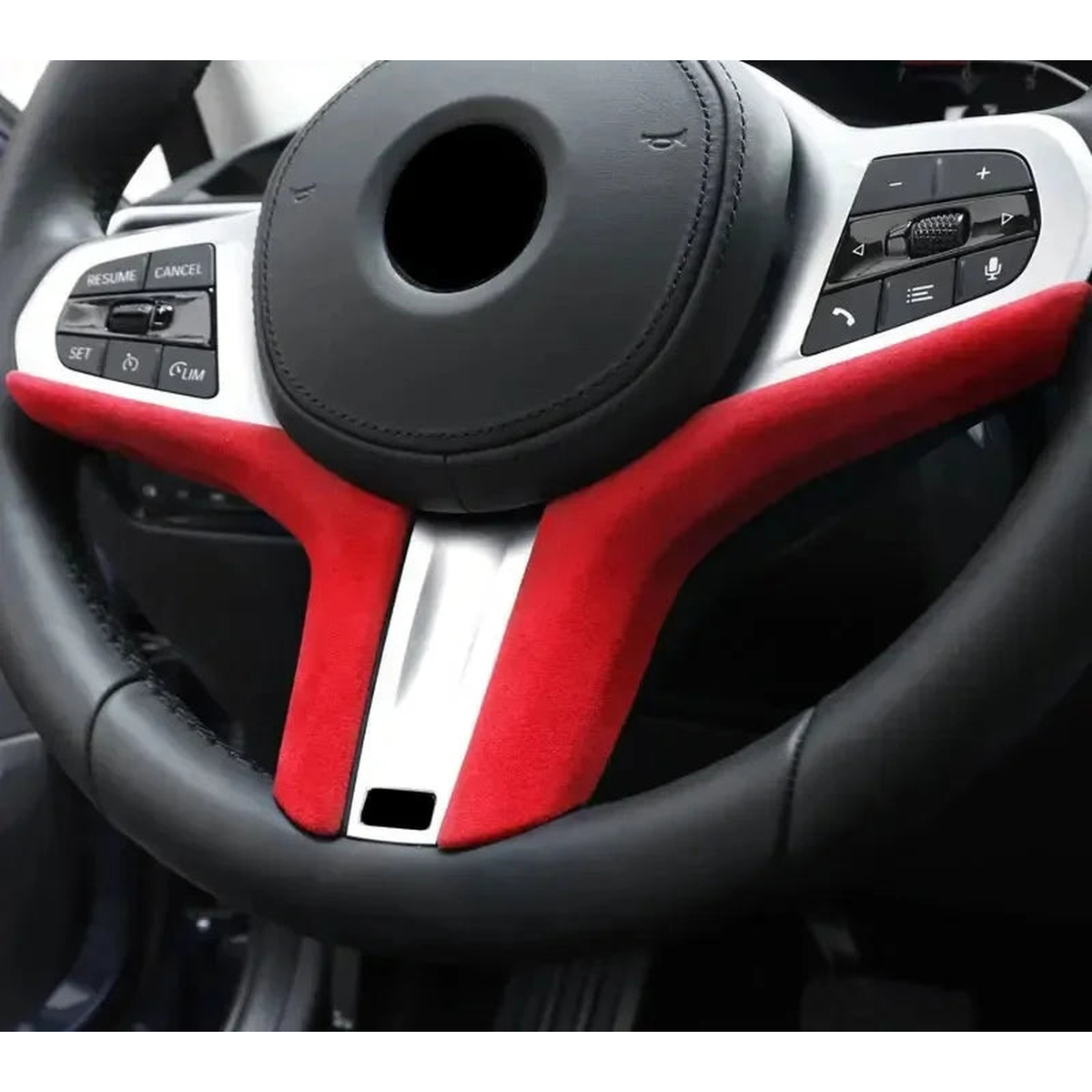 Red Alcantara suede steering wheel trim strip fitted to a BMW steering wheel, for BMW G20 / G29 / G30