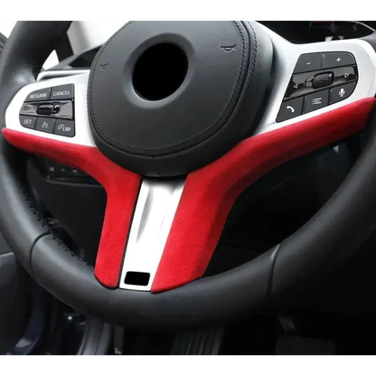 Red Alcantara suede steering wheel trim strip fitted to a BMW steering wheel, for BMW G20 / G29 / G30