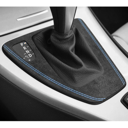 Blue stitched Alcantara gear selector panel trim fitted around the automatic shifter in a BMW E90 / E92 / E93