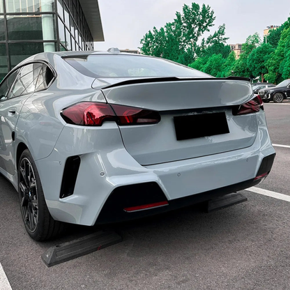 Trunk lid spoiler fitted on a BMW 2 Series F74 (2024+), rear view
