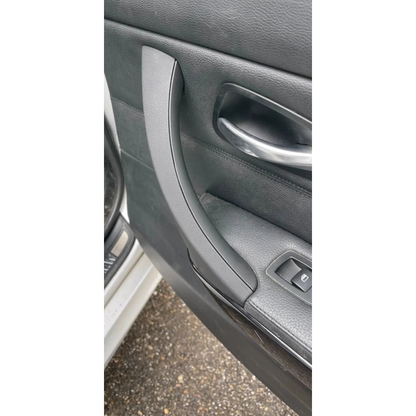 Black door pull handle installed in a door panel, for BMW 3 Series E90, E91, E92 (2005-2012)