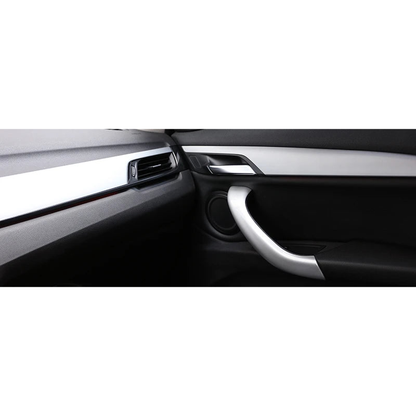 Silver door pull handle cover installed on the interior door panel of a BMW X1 F48 / F49, X2 F39 (2016-2020)