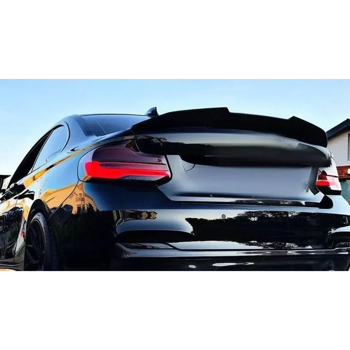 Trunk spoiler installed on a BMW 2 Series coupe, rear view, for BMW F22 / F87 M2 (2014-2020)